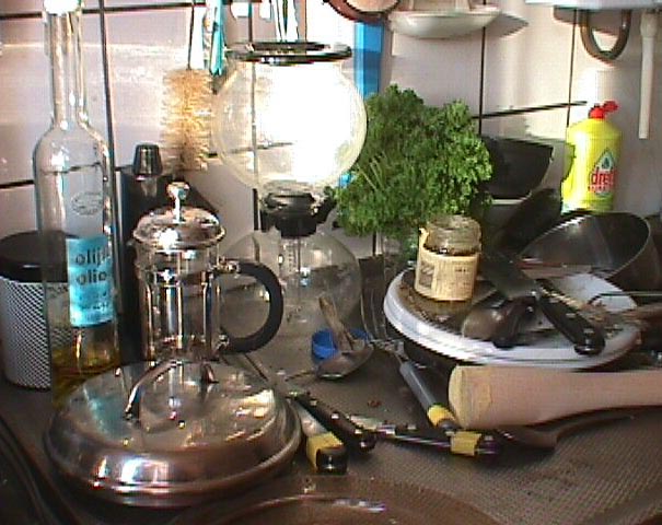picture of knives, koffee cookers, oil, pesto, and parsley